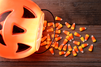 halloween candy corns in a pumkin candy bucket